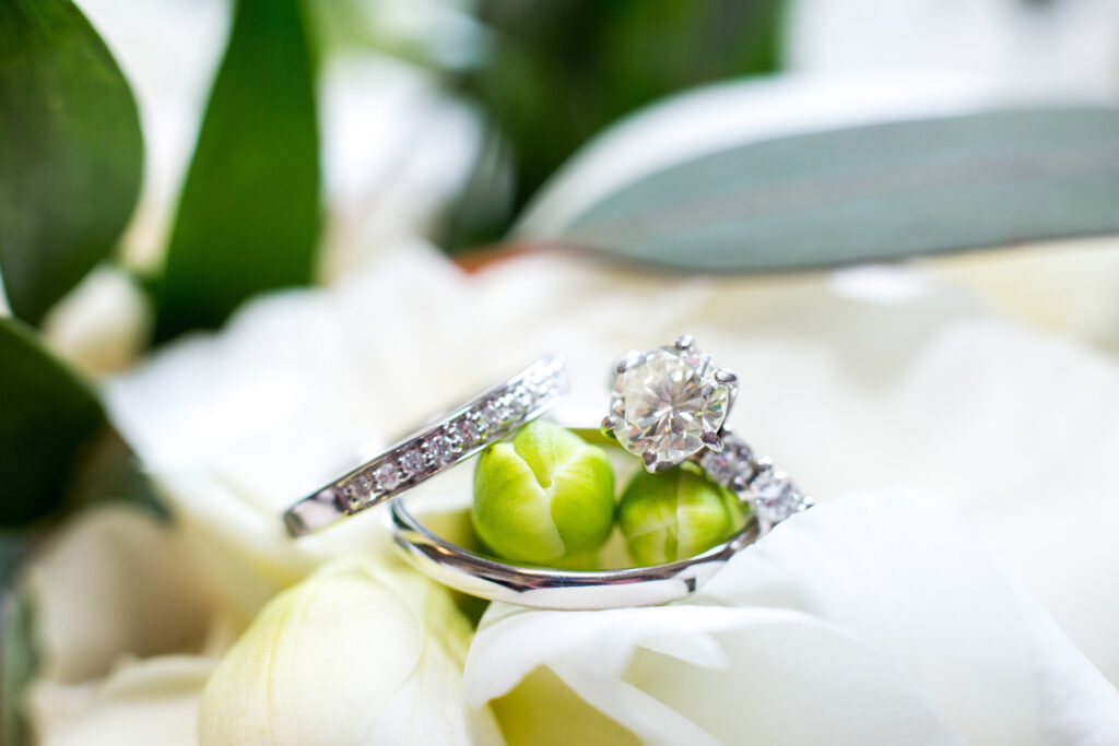 Rings at a wedding at the Adelphi Hotel by Saratoga wedding photographer Caitlin Miller