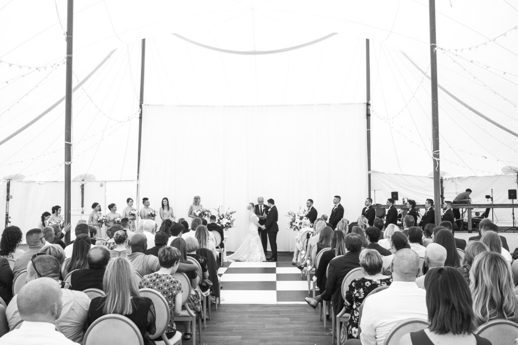 Ceremony at a wedding at the Adelphi Hotel by Saratoga wedding photographer Caitlin Miller