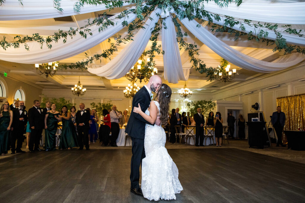 A bride and groom dancing at a wedding recpetion