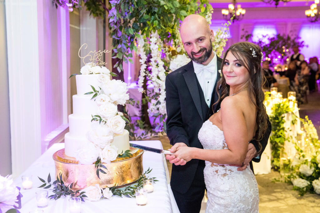 A cake cutting at a wedding reception at the Glen Sanders Mansion ballroom