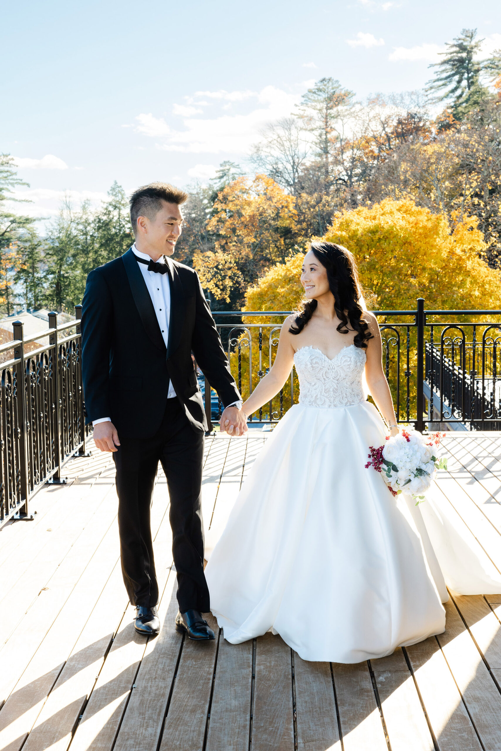 Newlyweds posing at the Inn at Erlowest, a wedding venue Upstate NY