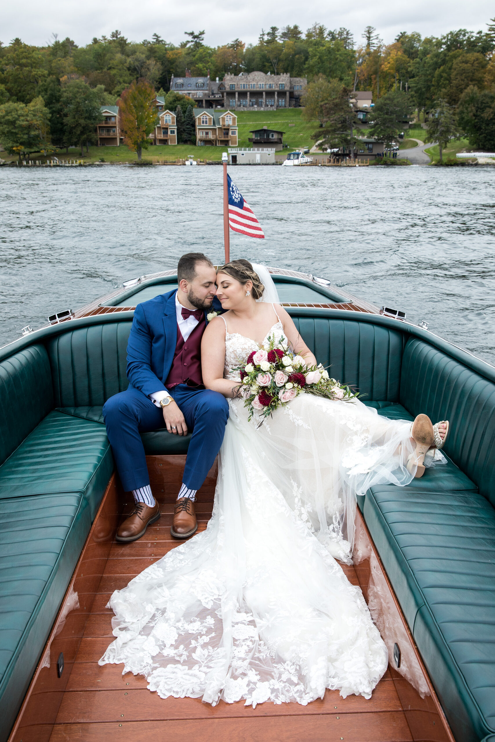 Bride and groom on a boat ride on lake george from a wedding in lake george at the Inn at erlowest