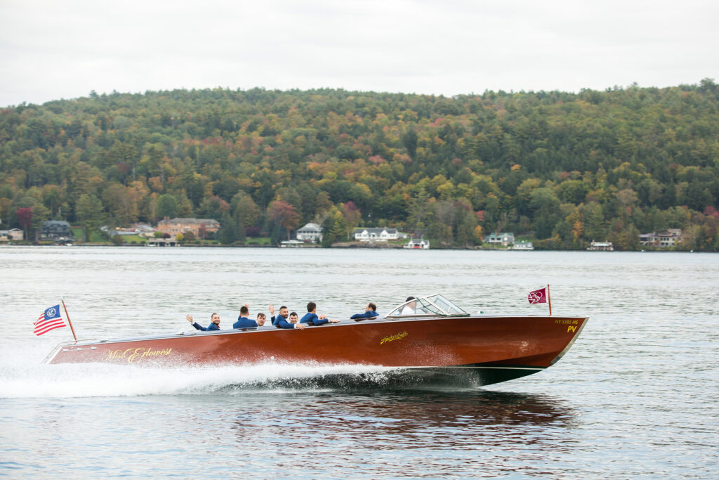 Groom on a boat from a wedding in lake george at the Inn at erlowest