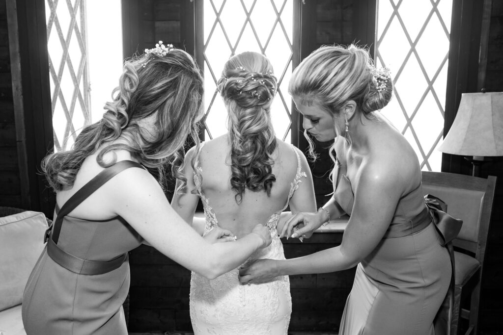 Bride getting ready at the Lake George Club by Lake george wedding photographer Caitlin Miller