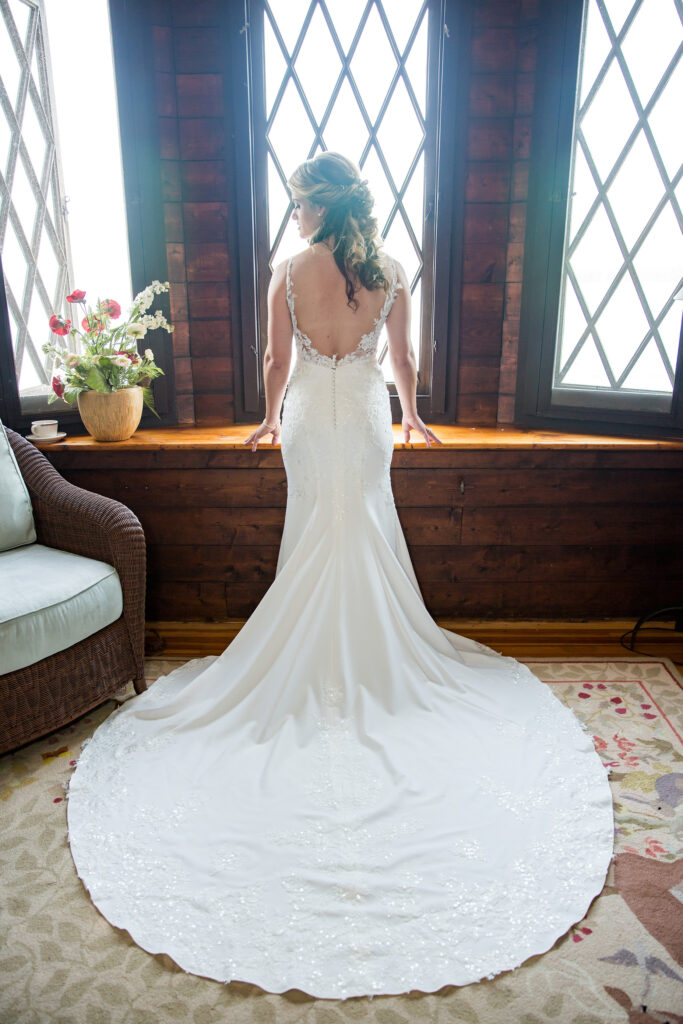 Bride getting ready at the Lake George Club by Lake george wedding photographer Caitlin Miller