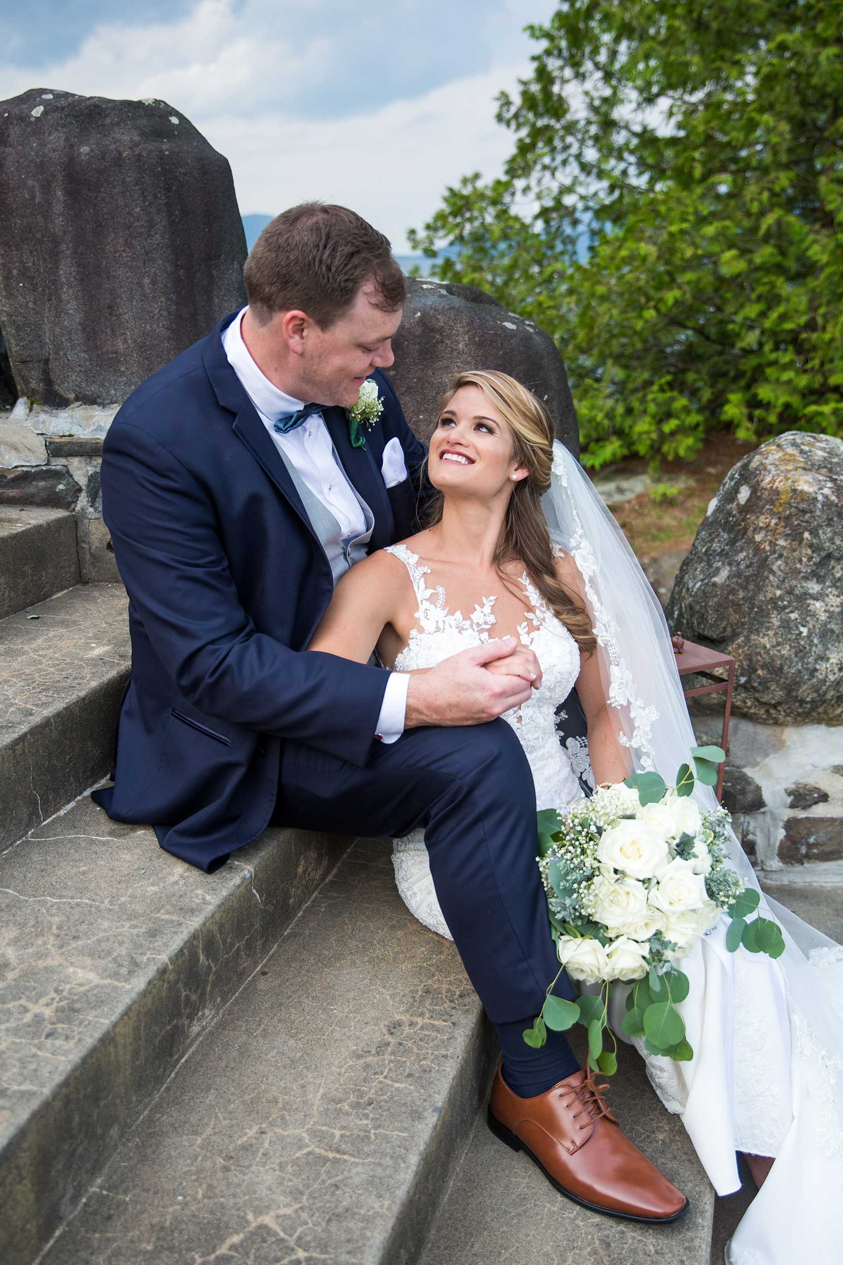 Bride and groom at the Lake George Club by Lake george wedding photographer Caitlin Miller