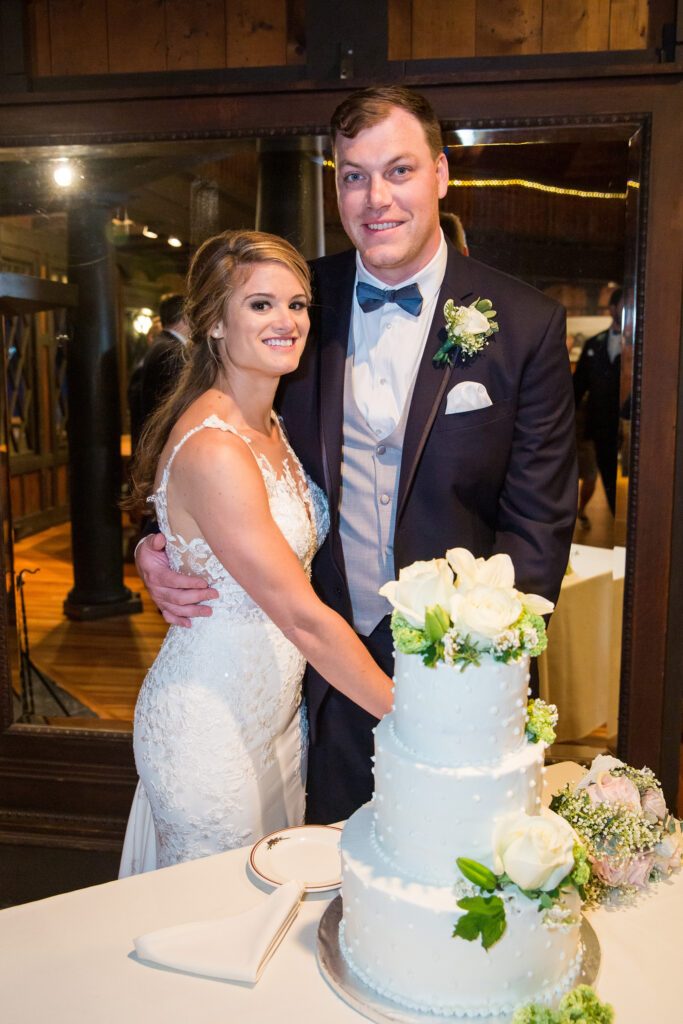 Bride and groom at the Lake George Club by Lake george wedding photographer Caitlin Miller