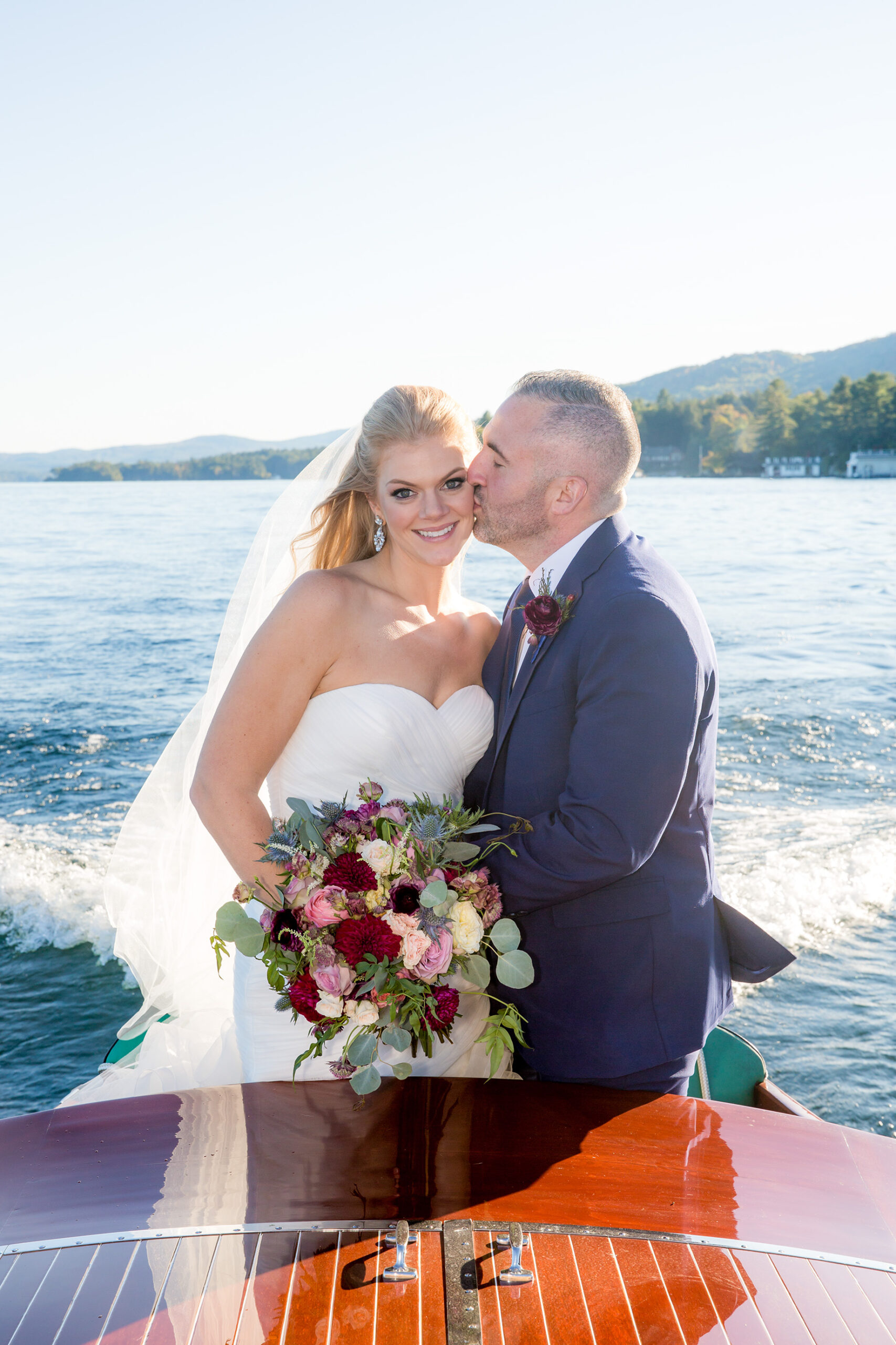 Bride and groom at the Lake George Club by Lake george wedding photographer Caitlin Miller