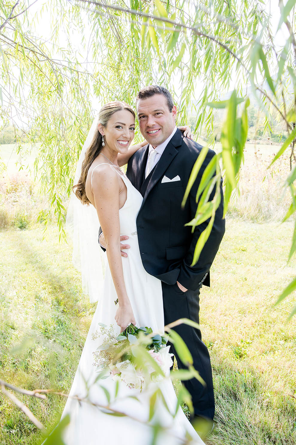 Photos of a couple at their Lake George wedding at the Barn at Lord Howe Valley by albany NY photographers