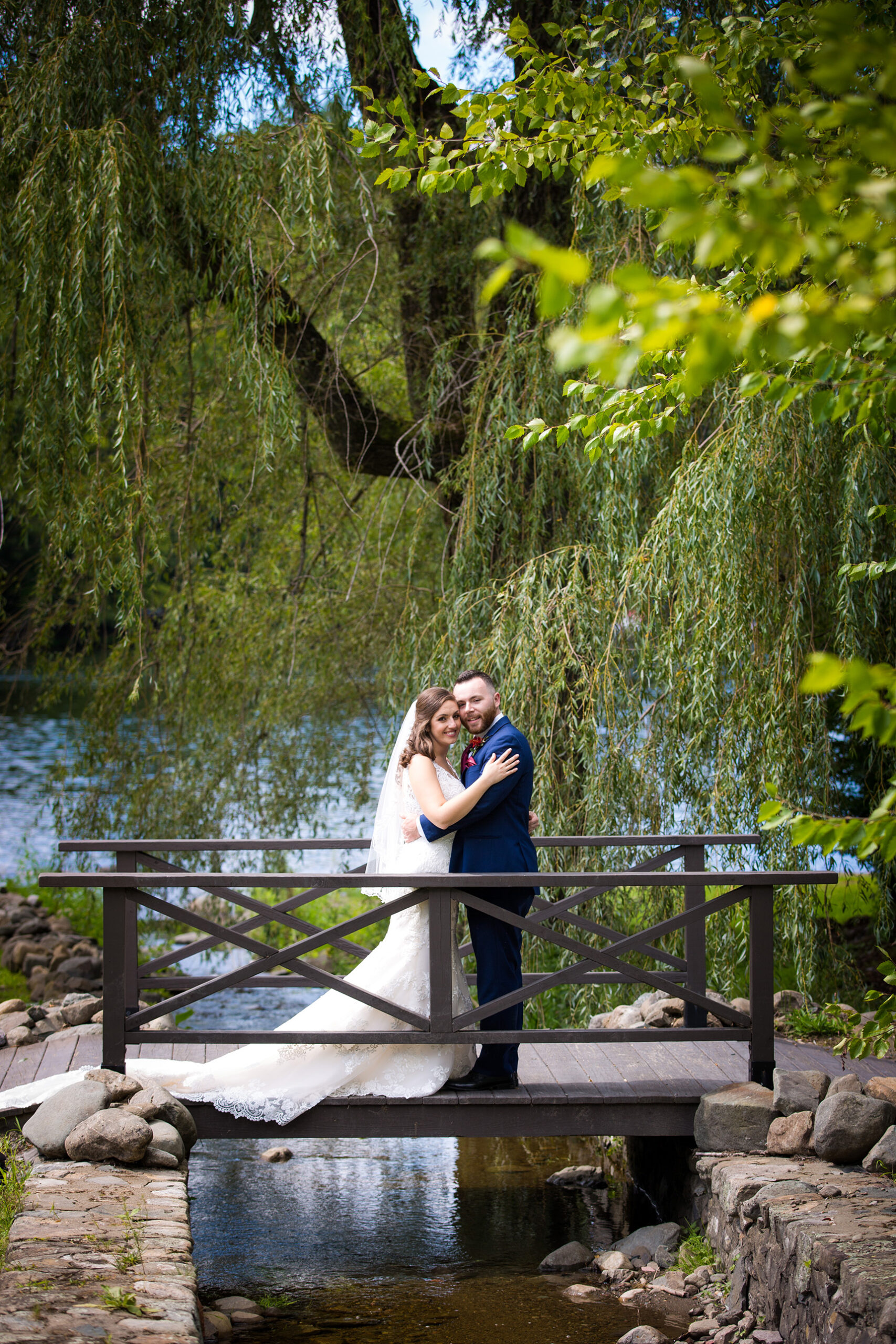 Bride and groom at the old daley on crooked lake by Lake george wedding photographer Caitlin Miller