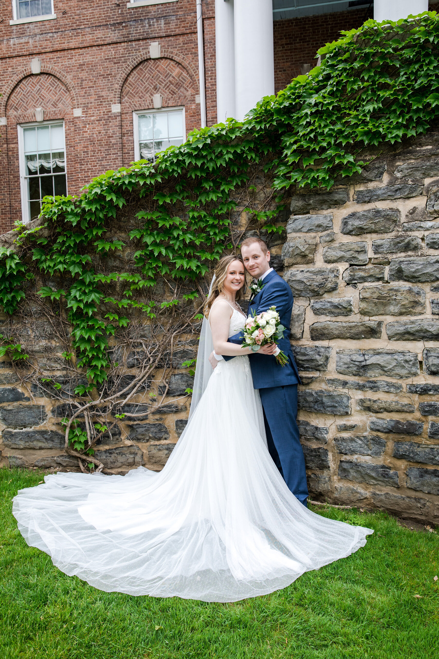 Bride and groom by lake otesaga at the otesaga hotel cooperstown ny, a cooperstown resort