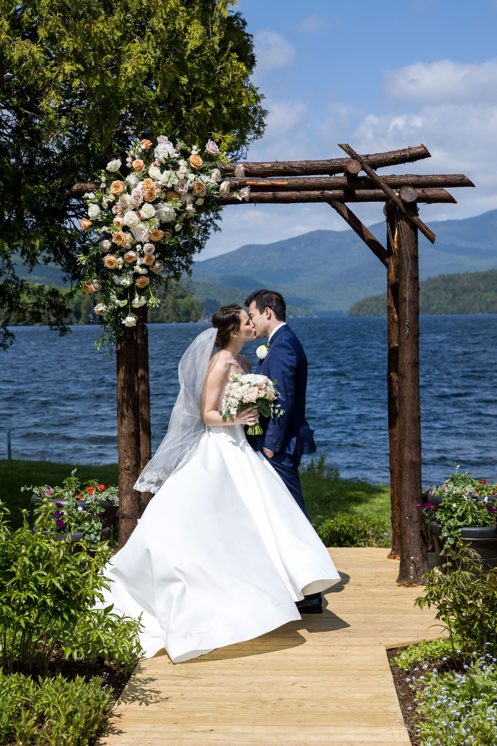 Newlyweds by the lake at the Lake Placid Club in Lake Placid Adirondacks