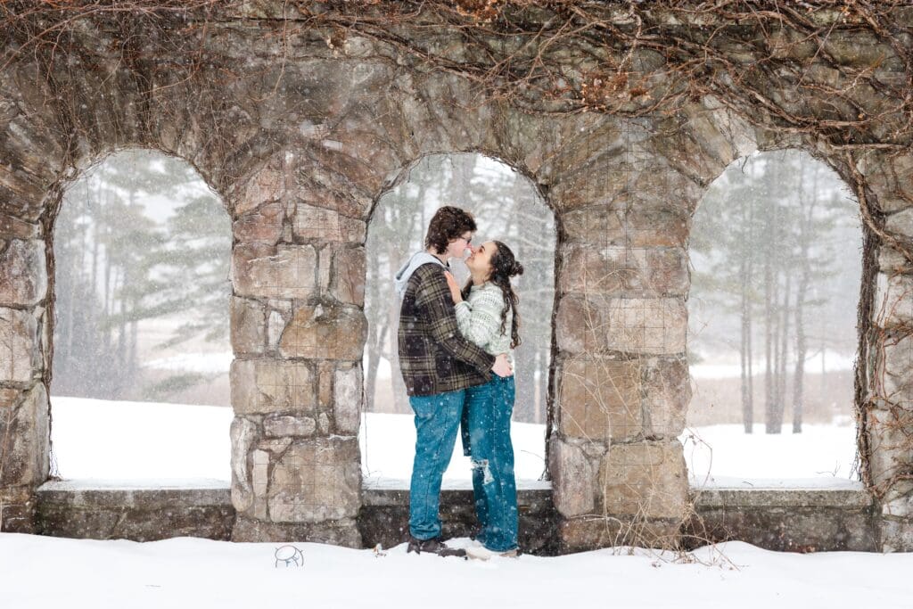 Photos from an engagement session at The Mount in Lenox Mass. The couple took photos at The Mount in a snowstorm - Photos by Saratoga Springs wedding photographer Caitlin Miller
