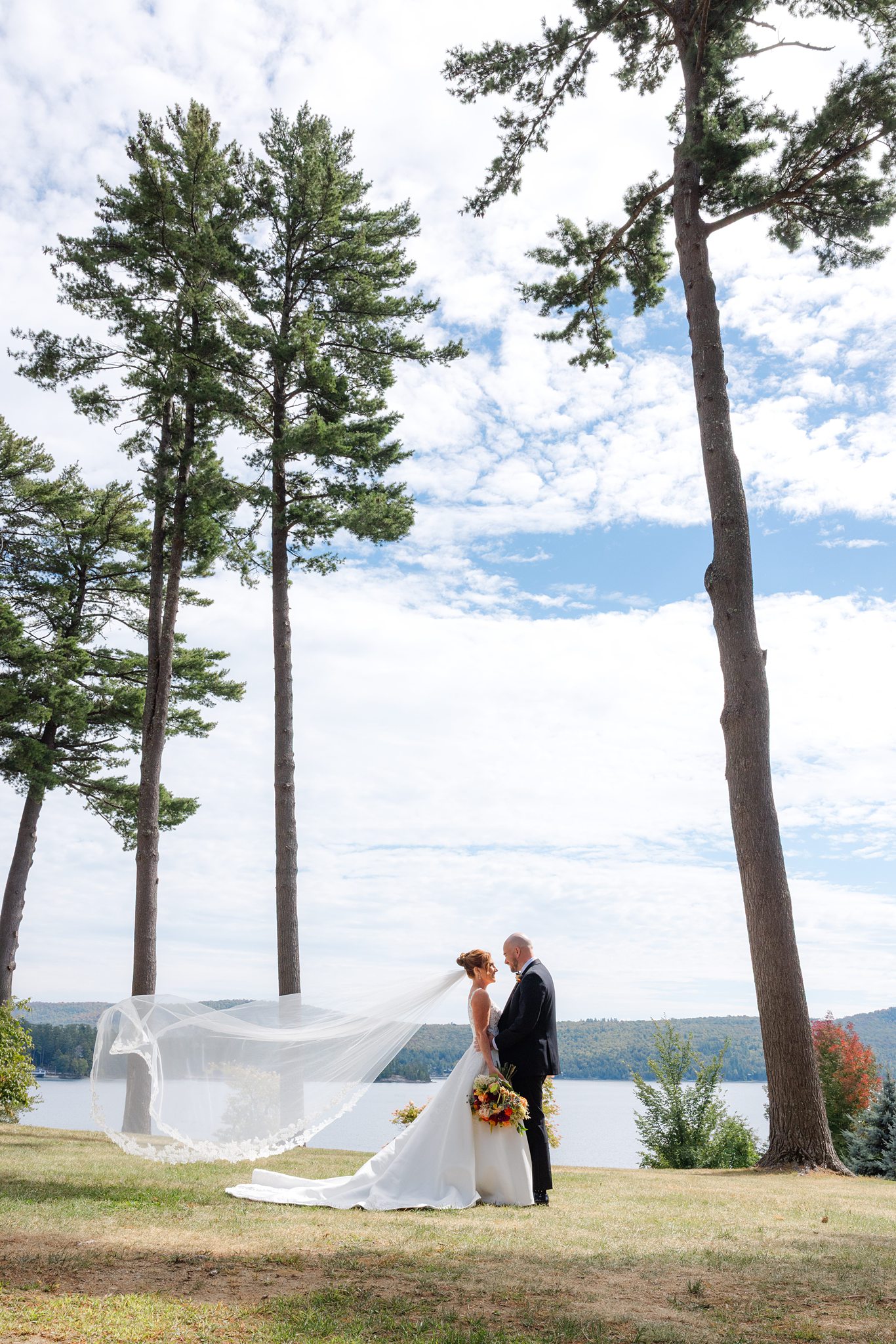 Romantic portraits by the lake at Adirondack wedding venue